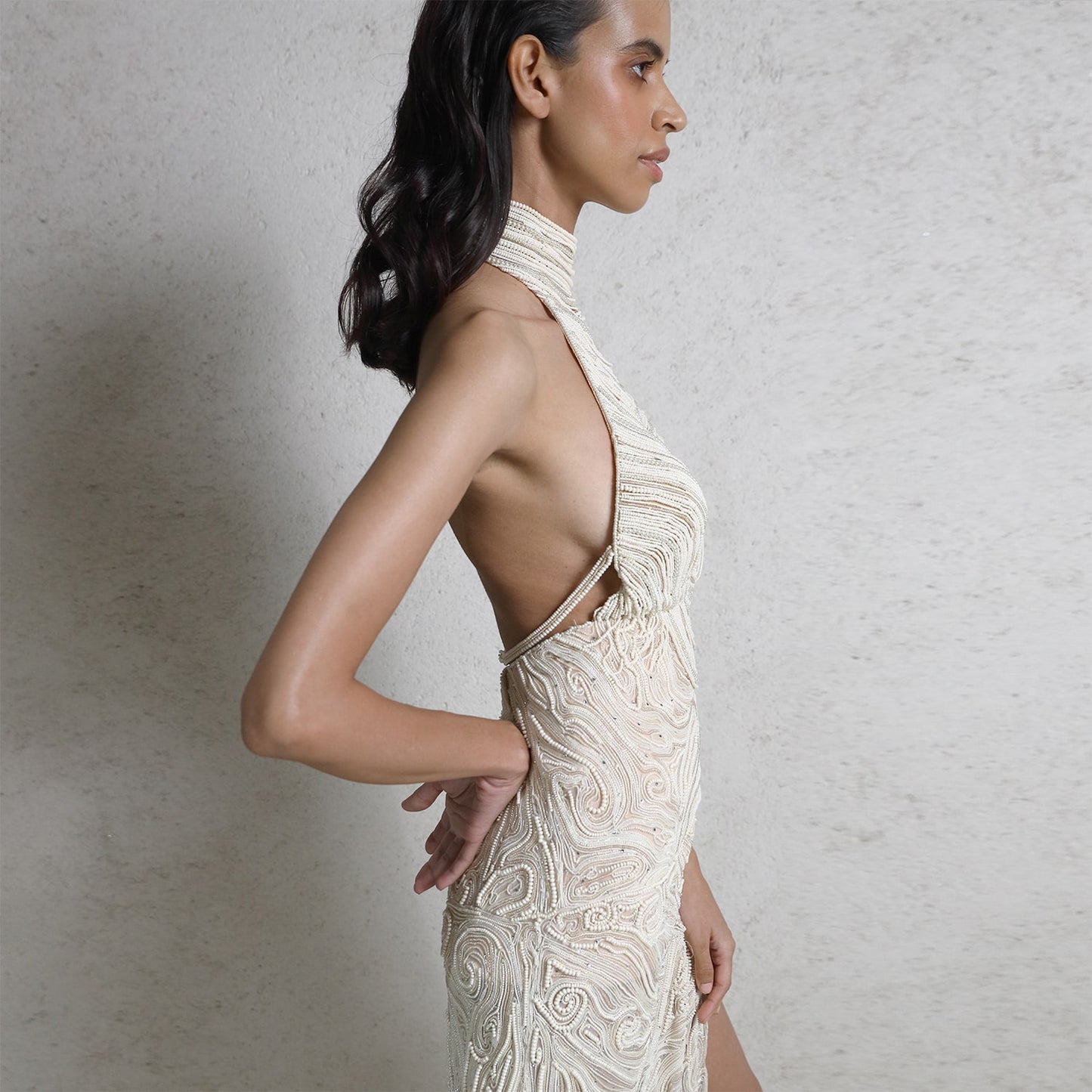 Draped pearl string red carpet gown