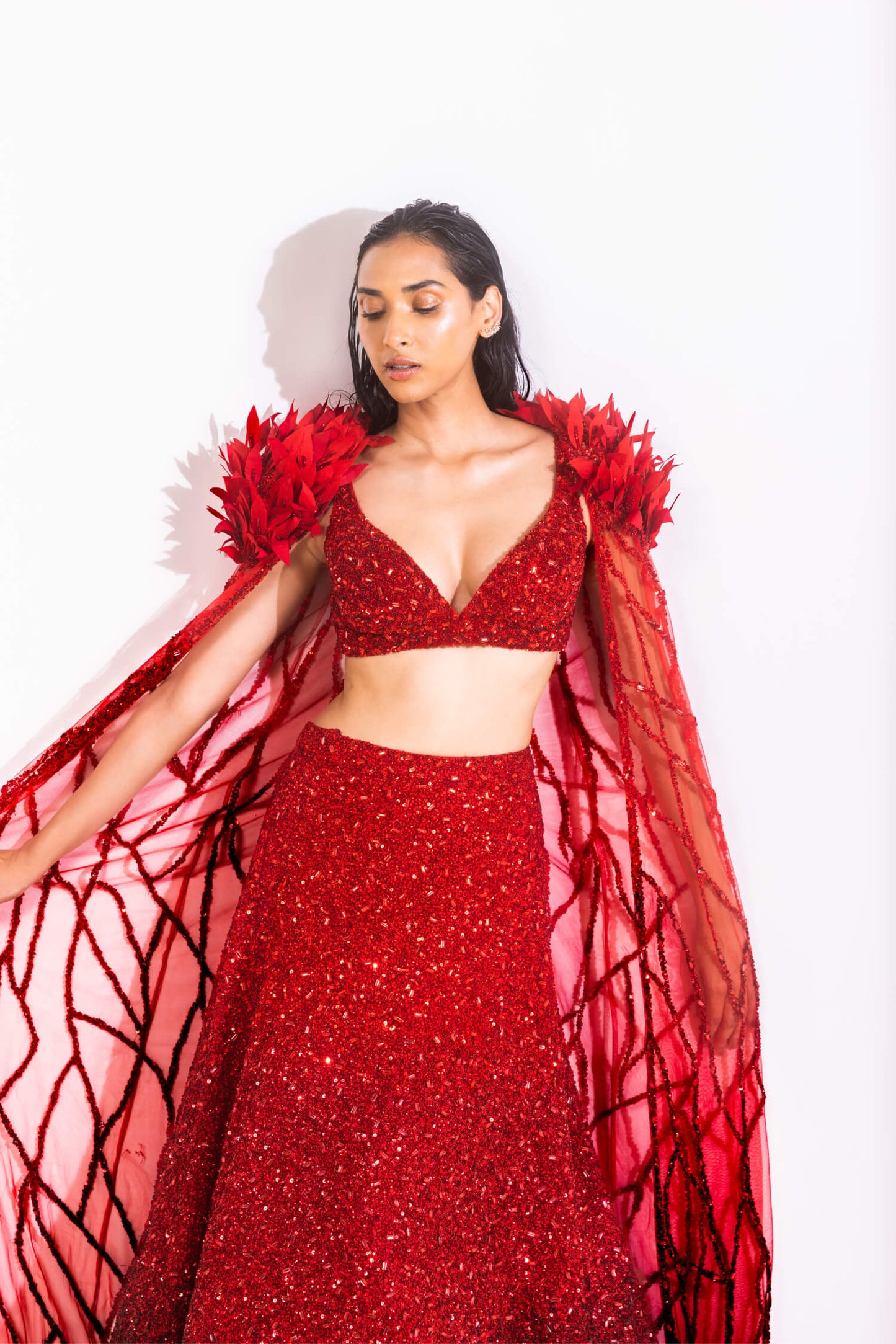 Red two piece lenngha set with feather detailed cape